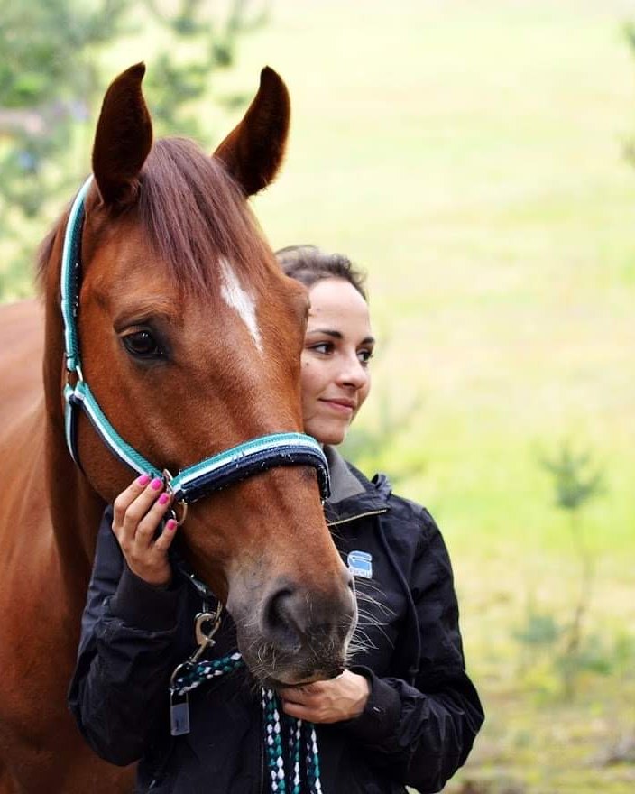 Linda with a horse in the forest